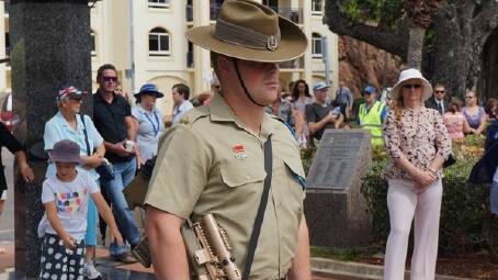 A soldier stands at attention as part of Anzac commemorations. 