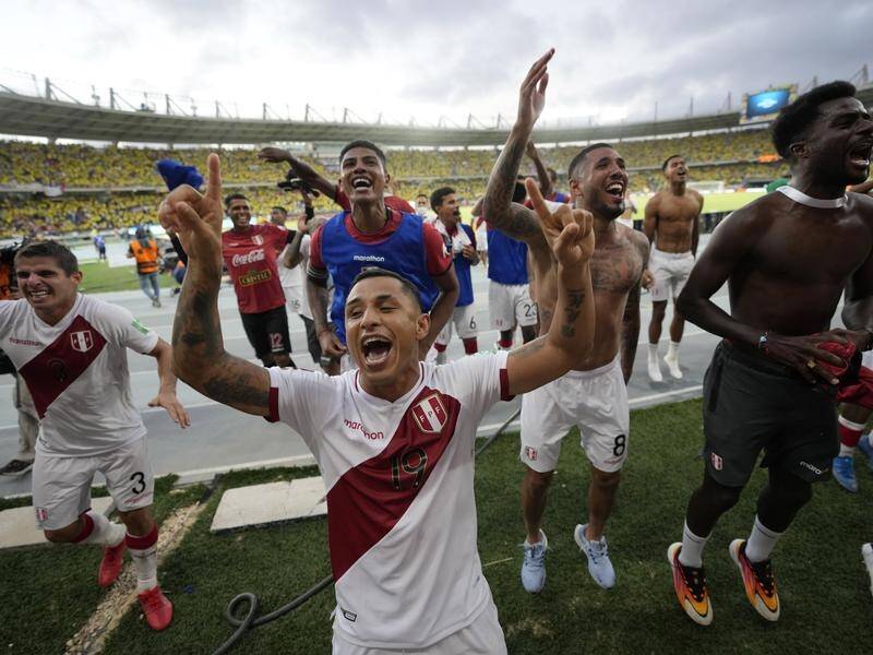Peru players celebrate their important World Cup qualifying win over Colombai in Barranquilla.