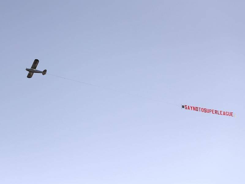 A plane with an anti-Super League banner flies over Leeds in England amid backlash from fans.