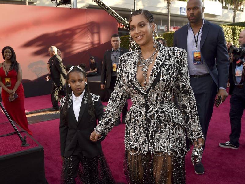 Blue Ivy (L) shares songwriting credit and now an award for mum Beyonce's hit song Brown Skin Girl.