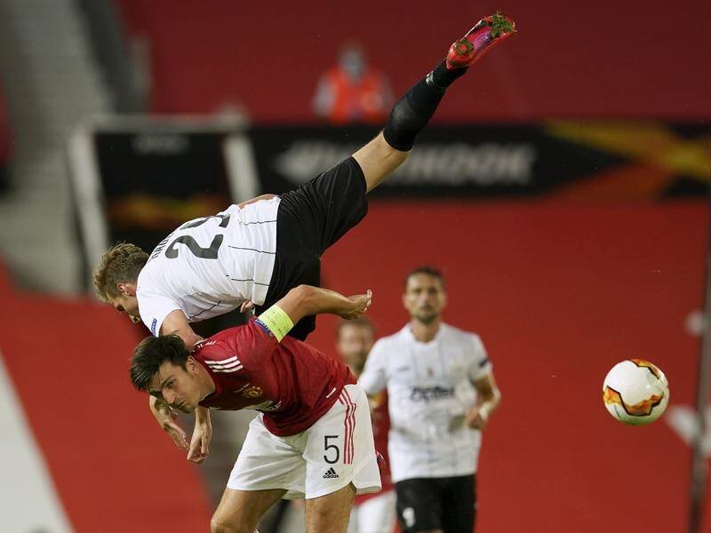 LASK's Marko Raguz is airborne in his battle with Manchester's Harry Maguire which United won 2-1.