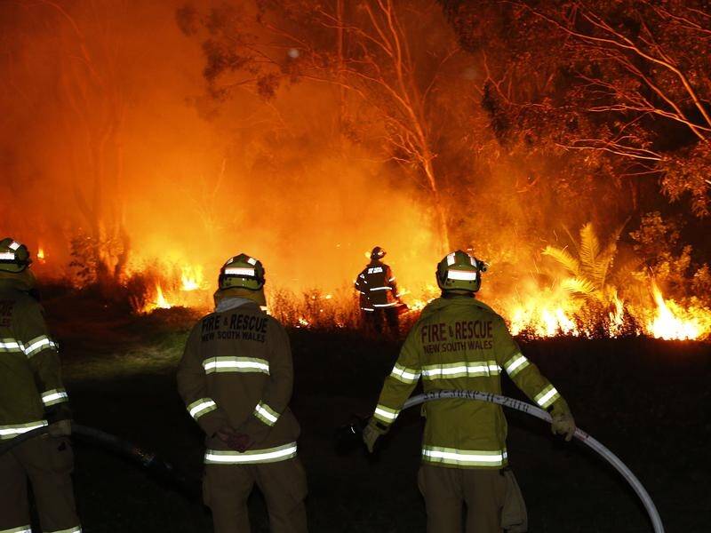 Fire crews in NSW's Hunter region battled to save homes from a fast-moving bushfire overnight.