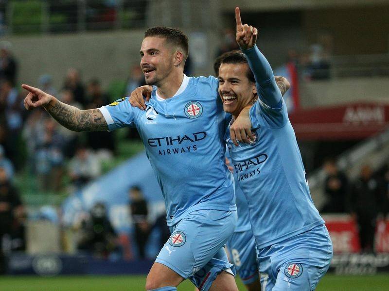 Jamie Maclaren (l) scored five goals in Melbourne City's 7-0 derby thrashing of the Victory.