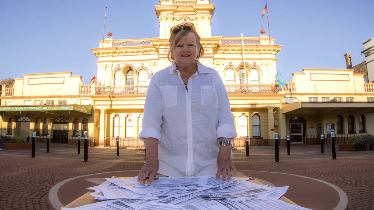 Deputy Mayor Carol Sparks with the petition signed by 1,600 people.