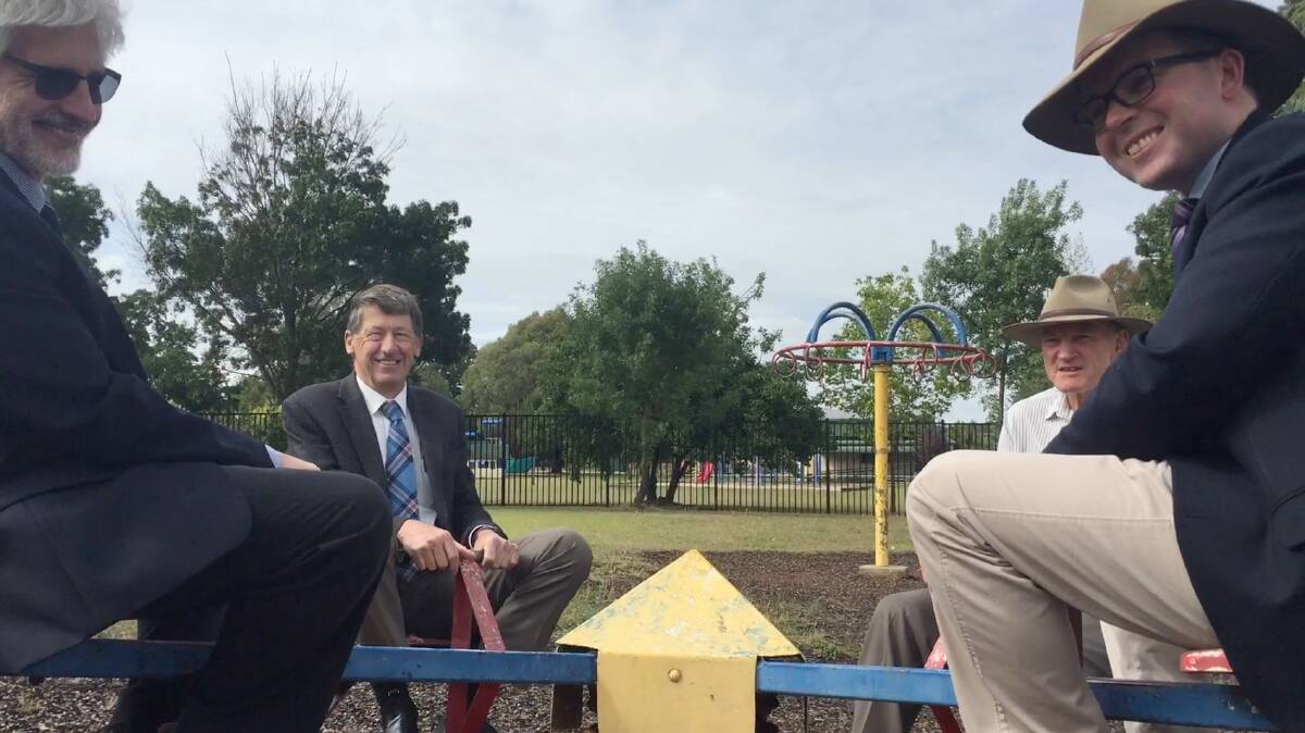 Council General Manager, Hein Basson, Mayor Steve Toms, former mayor, Colin Price and Northern Tablelands MP, Adam Marshall, on the children's equipment at Melling Park.