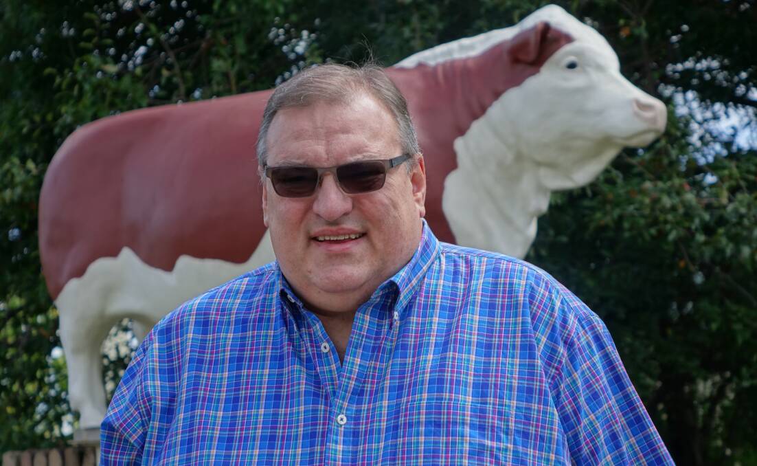 Taking the bull by the horns. John McCluskey, new president of the art gallery, with a business background as the owner of the Rest Point Motor Inn and Hereford Steakhouse.