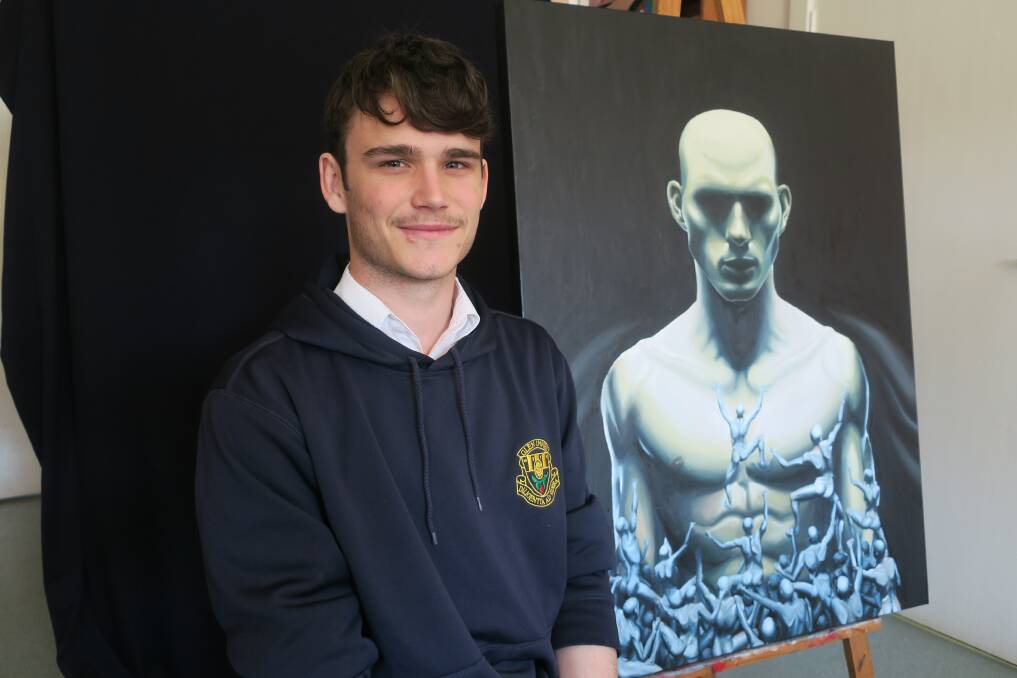 Lachlan Martin with one of his paintings.