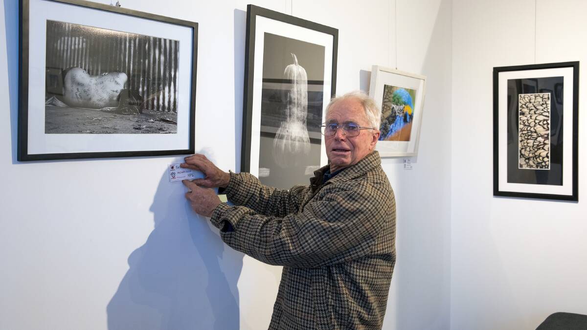 Curator, Denis Haselwood who has organised many photographic exhibitions.