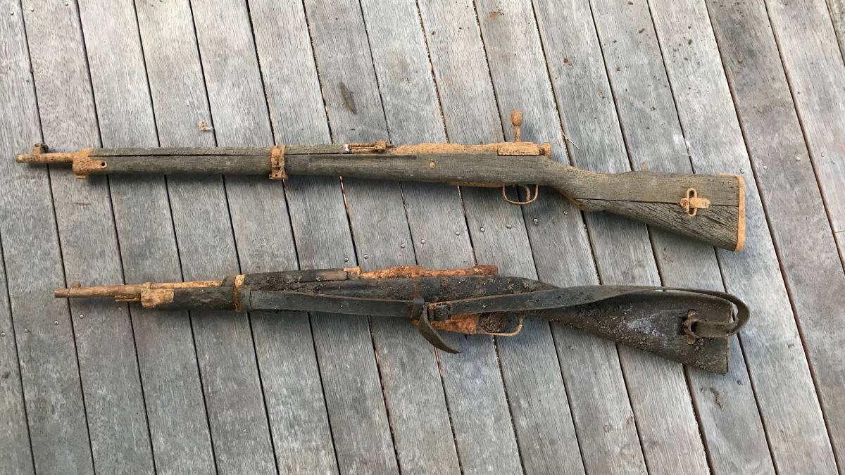 The two WWII weapons looked as though they had been in the water for a very long time.