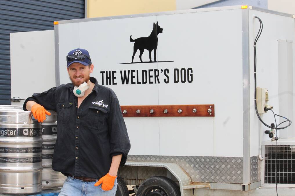 REPURPOSED: Dan Emery in front of what was to be a mobile beer coldroom, but is now used to transport boxes of meat, fruit and vegetables.