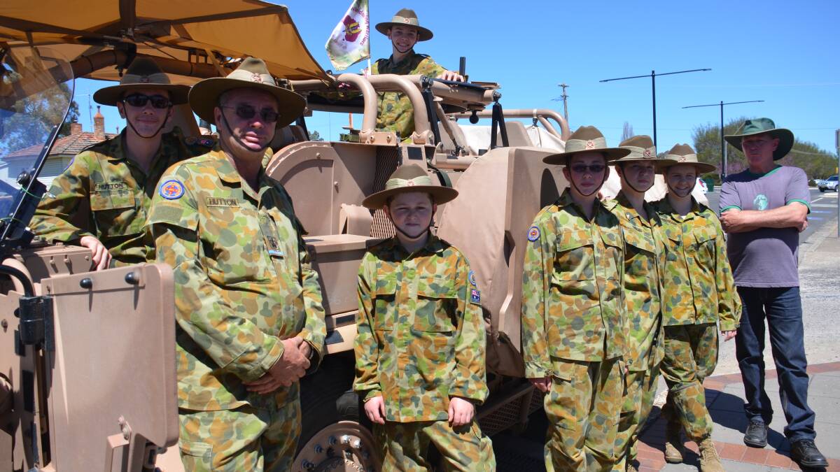 o Army arrives: Cadet Hutton, Warrant Officer Class 2 Hutton, Cadet Whitehouse, Cadet Hutton, Cadet Corporal Reid, Cadet Gresham (top), Cadet Carpenter-Kerr and RSL president Gordon Taylor take their positions with the long range patrol vehicle that makes up part of the vehicle convoy the SAS arrived with in Glen Innes.