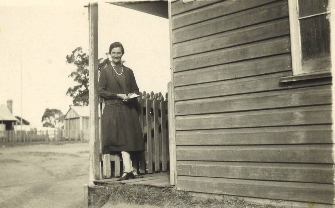 Vital role in the community: Mary Cornish on the veranda of the Red Range Post Office.