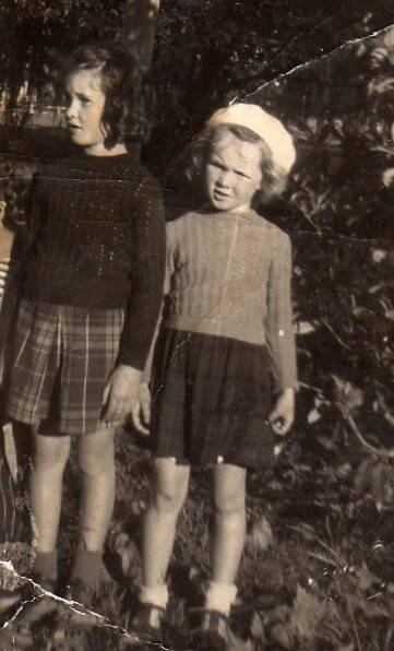  Fay and Barbara Readett in the 1950s wearing tartan skirts and hand knitted jumpers.