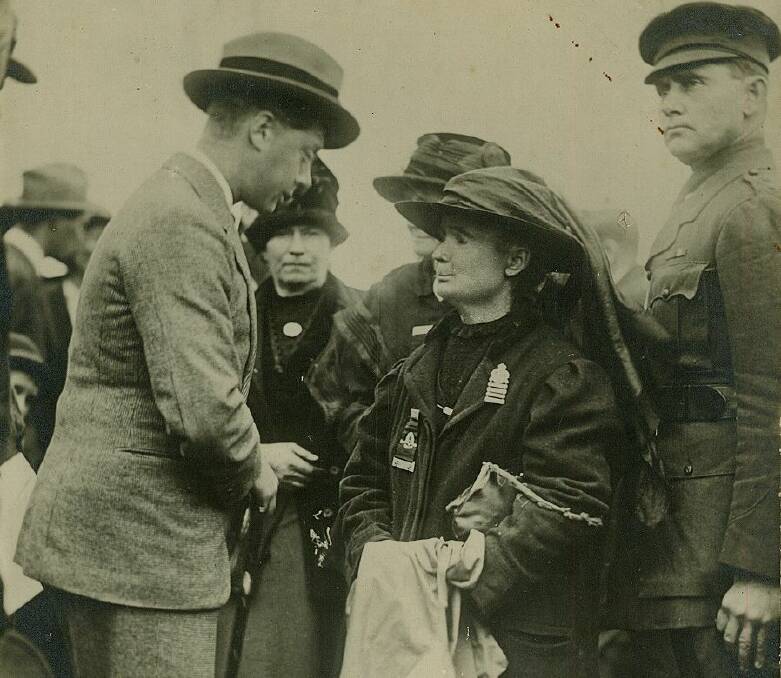 The Prince chatting with Mrs Martha Johnston who had five sons at the War, two of whom were killed.