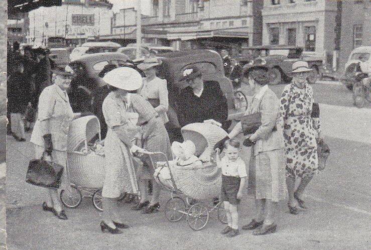 Immigration promotion: Mothers meet in their hats, gloves, high heels and stockings, with their cane prams in Grey Street in the late 1940s.