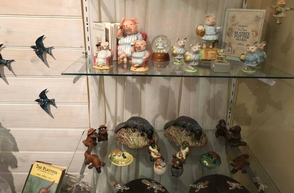 Collector's items: One of the cases with Beatrix Potter figures and just some of the platypus collection.