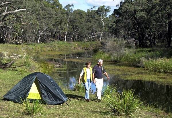 o Idylic scene in National Park : Over 50, 000 people visited the National Parks in the Glen Innes region last year. Photo of Skye and John McKenny courtesy of the Glen Innes Visitors Information Centre, taken by Paul Matthews. 