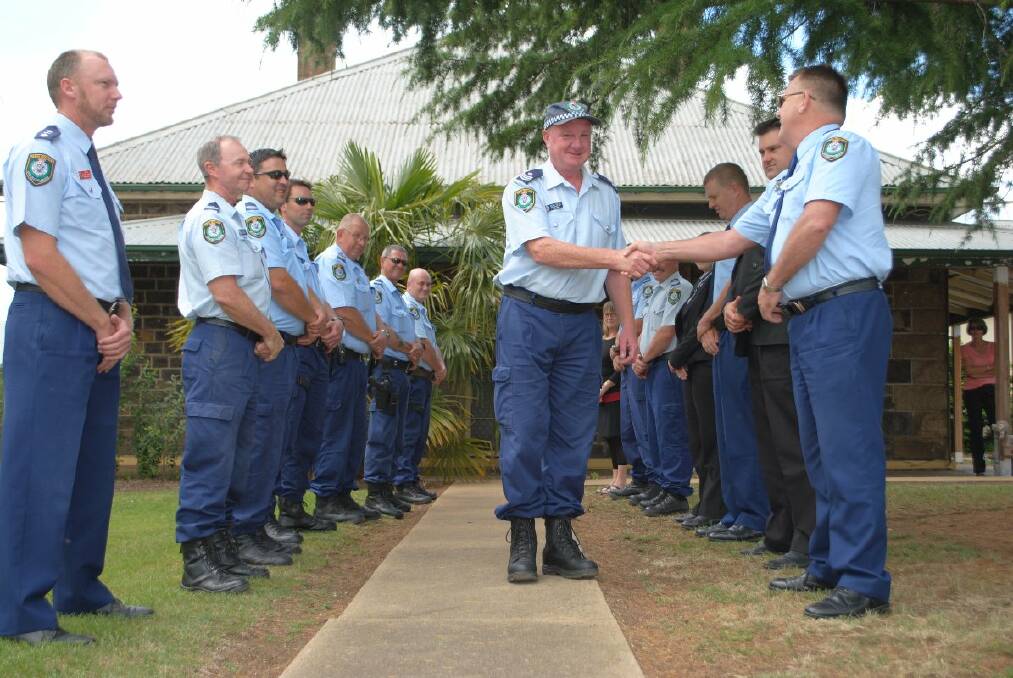 o Retiring to greener pastures: Sergeant Adam Ralph’s fellow officers form a guard of honour as they farewell the station’s longest-serving officer.